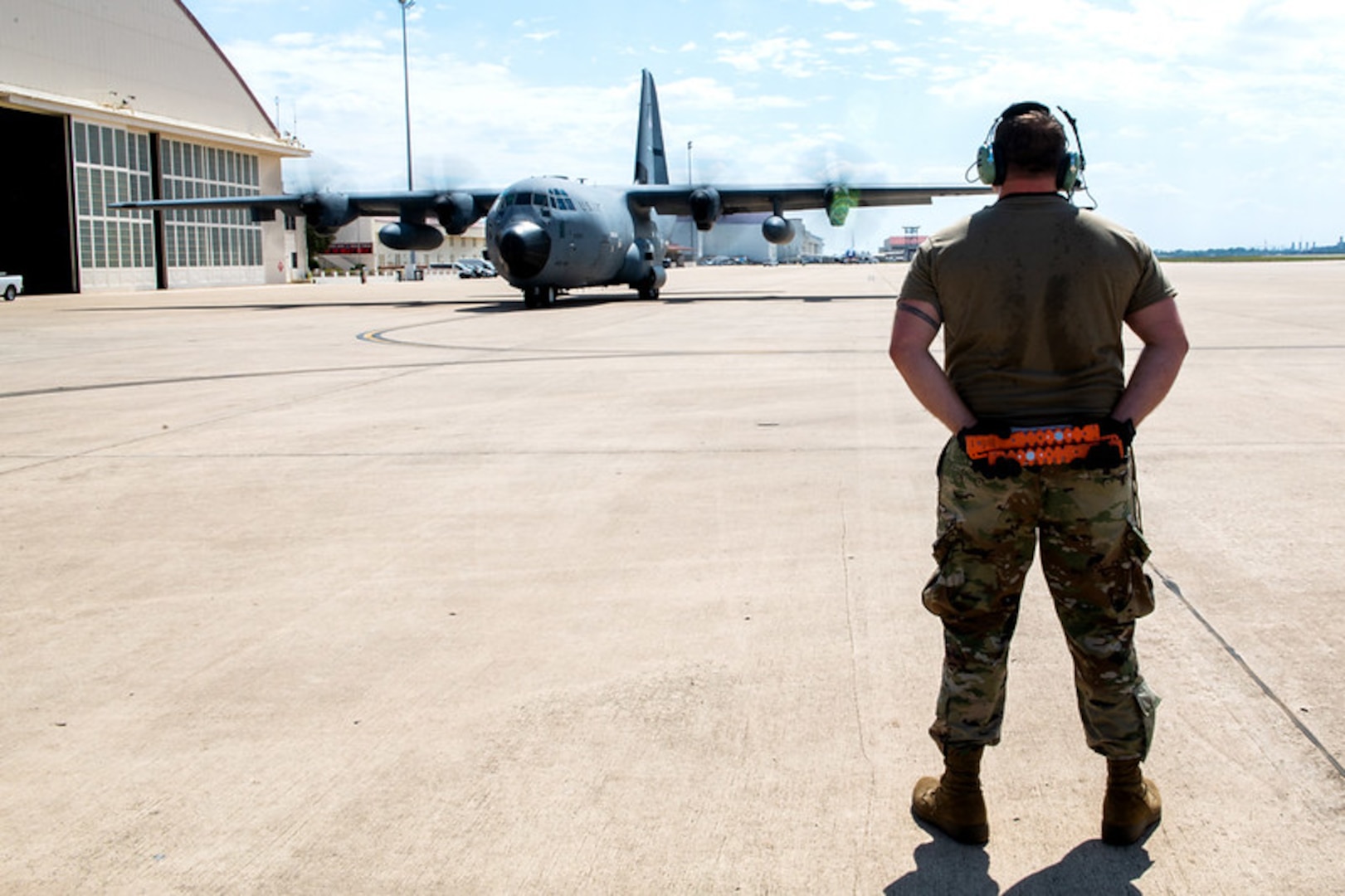 Master Sgt. Kevin Cheatham, 403rd Aircraft Maintenance Squadron, Keesler Air Force Base, Miss., prepares to marshal a C-130 in support of hurricane evacuation operations during hurricane Delta Oct. 8, 2020, at Joint San Antonio-Kelly Field, Texas. Eleven C-130s from the 403rd Wing, Keesler Air Force Base, Miss., were moved to JBSA-Kelly Field.