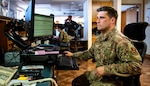 Staff Sgt. Tyler, 502nd Operations Support Squadron airfield management, looks up information for C-130 air crews in support of hurricane evacuation operations during hurricane Delta Oct. 7, 2020, at Joint San Antonio-Kelly Field, Texas.