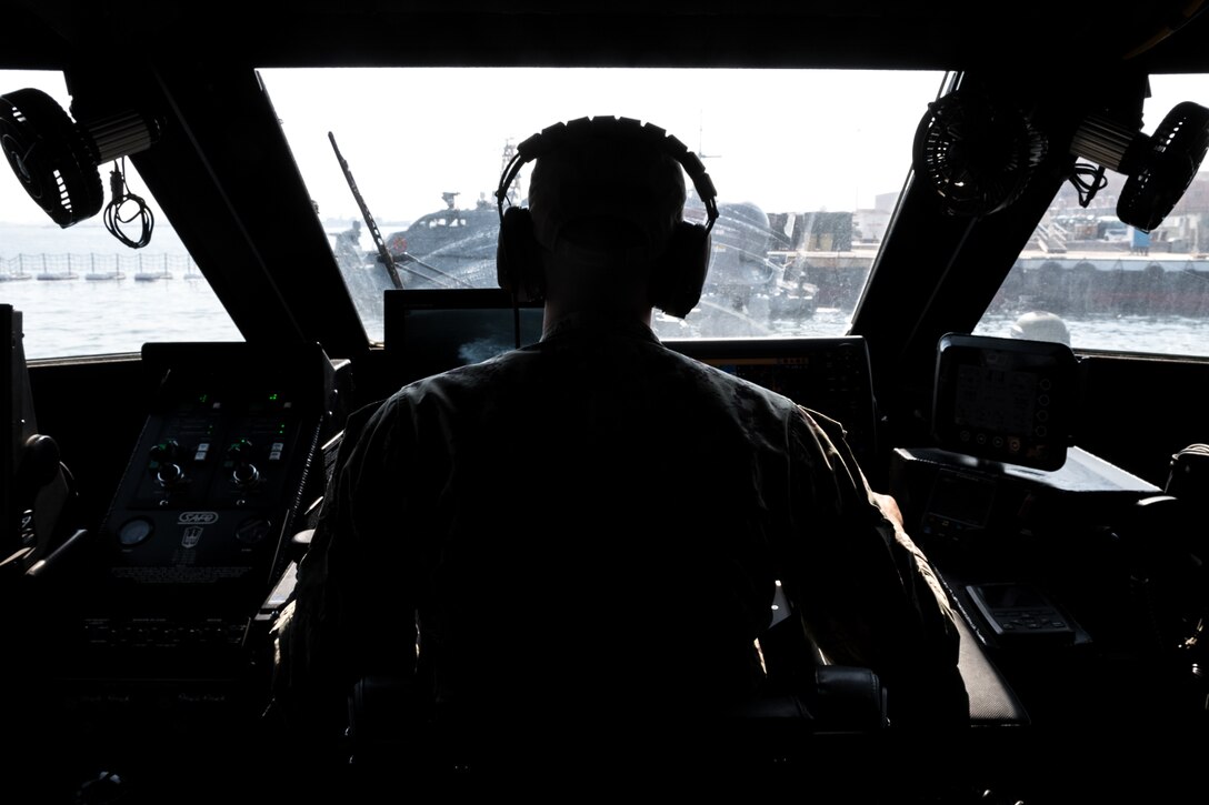 201015-N-KC128-0238 NAVAL SUPPORT ACTIVITY BAHRAIN (Oct. 15, 2020) A Sailor assigned to Commander, Task Force (CTF) 56 pilots a Mark VI patrol craft during an underway in the Arabian Gulf, Oct. 15. CTF 56 is responsible for the planning and execution of expeditionary missions in the U.S. 5th Fleet area of operations in support of naval operations to ensure maritime stability in the Central Region, connecting the Mediterranean and Pacific through the Western Indian Ocean and three strategic chokepoints to the free flow of global commerce. (U.S. Navy photo by Mass Communication Specialist 1st Class Daniel Hinton)
