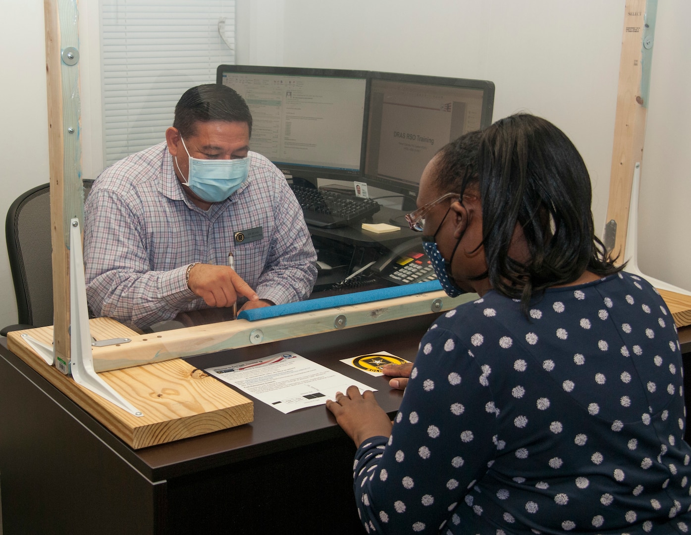 Joe Silvas Jr., military retirement services officer, 802nd Force Support Squadron, meets with a client to discuss available services at the Retirement Services Office on Joint Base San Antonio-Fort Sam Houston Oct. 15, 2020.