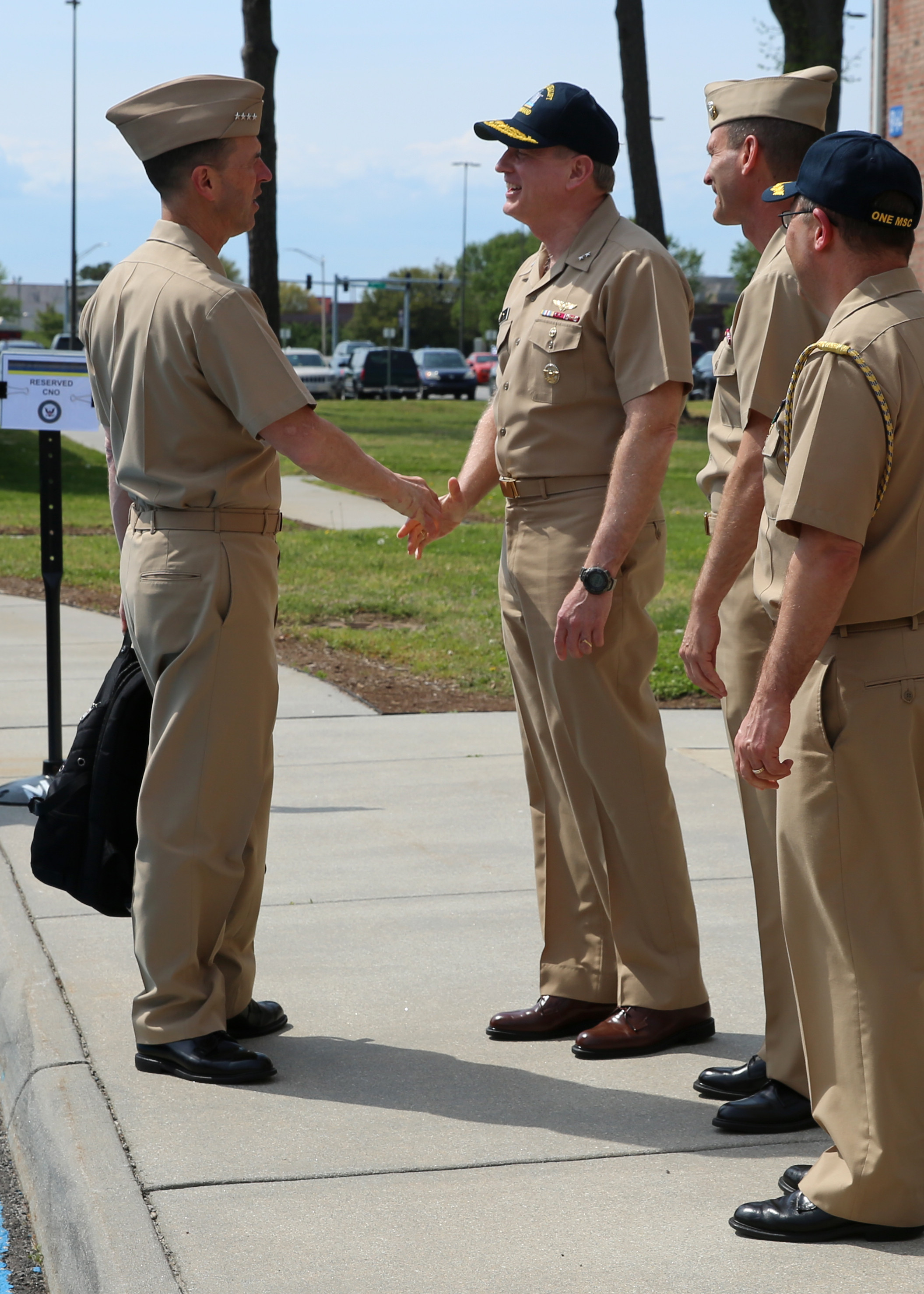 Chief of Naval Operations (CNO) Adm. John Richardson shakes hands with Rear Adm. Dee Mewbourne