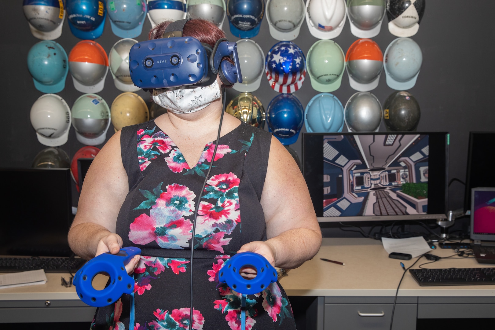 Public Affairs Specialist Kristi Britt test drives the virtual reality simulation in the NNSY Technology and Innovation Lab.