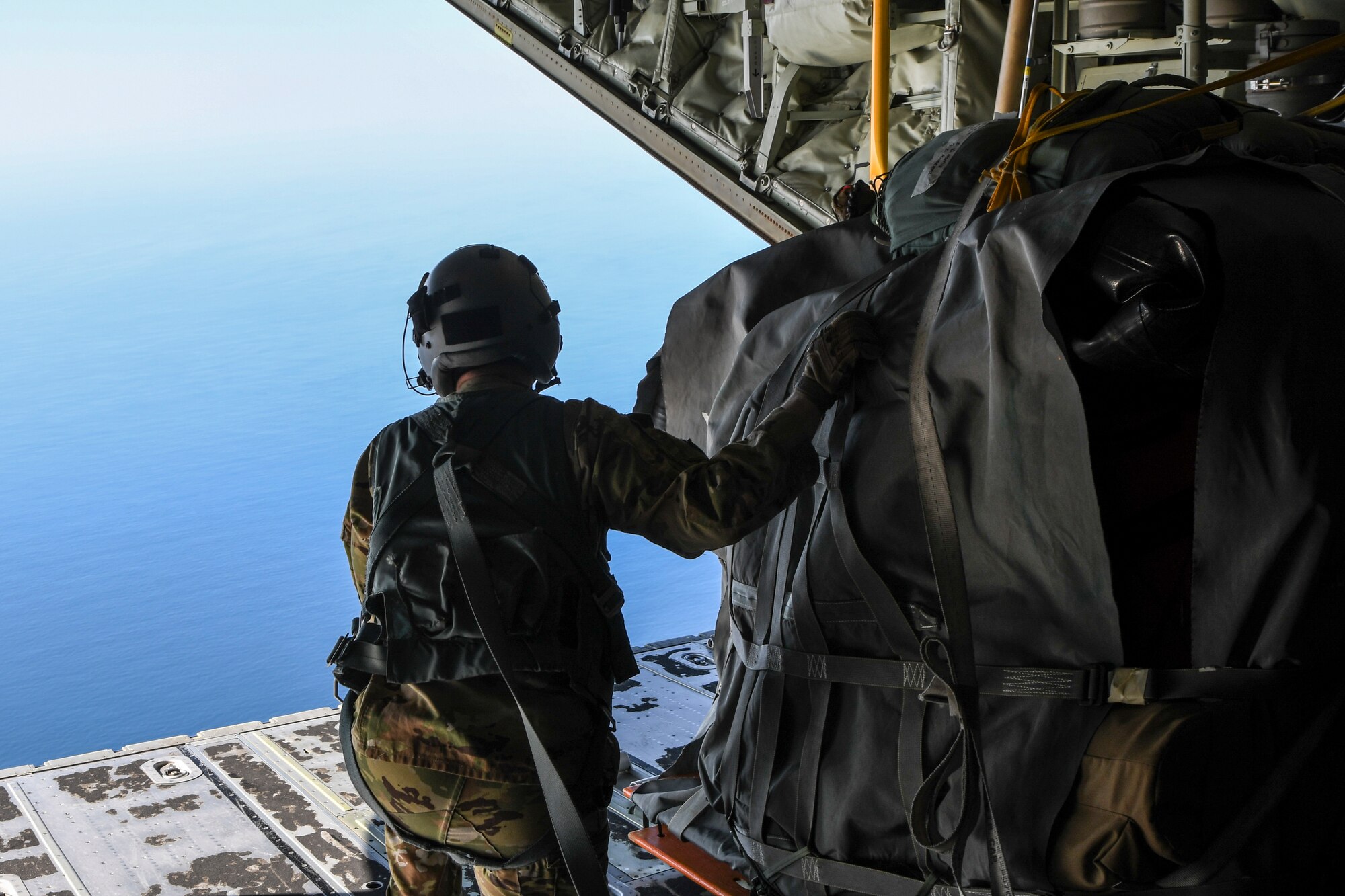 A photo of an Airman in the back of a C-130