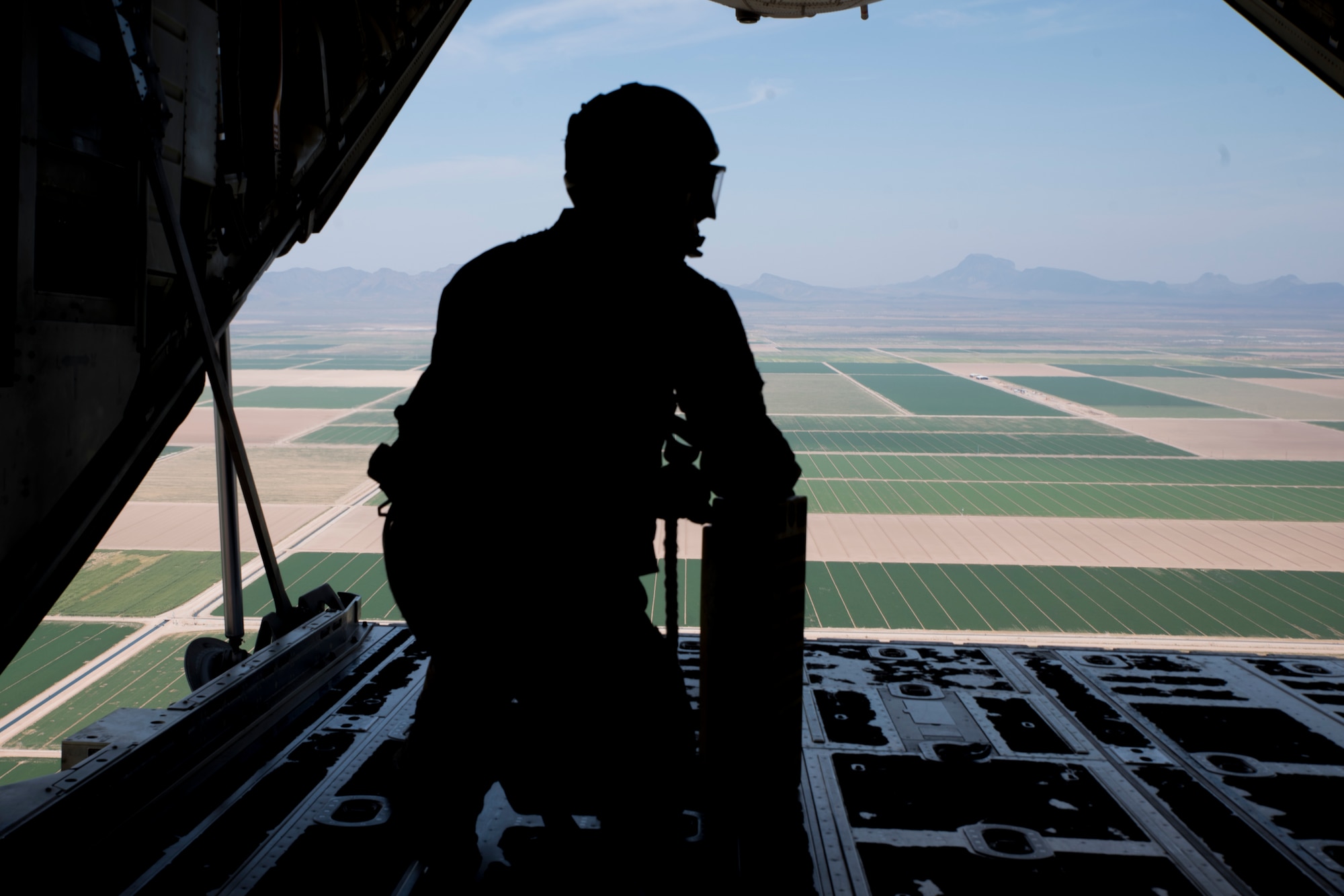 A photo of an Airman in the back of a C-130