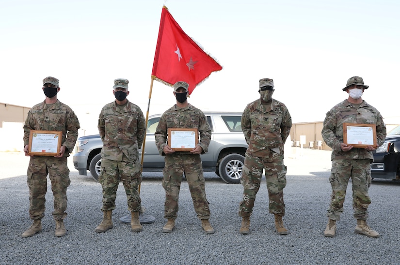 Sgt. Matthew Chatfield (center) stands with the Task Force Spartan’s Command Team and the 2nd and 3rd place winners of the first annual Task Force Spartan Small Arms Marksmanship Competition in the Central Command Area of Responsibility on Oct. 08, 2020. Chatfield placed first in the competition beating out 36 other Soldiers for the title. (U.S. Army photo by Sgt. Trevor Cullen)