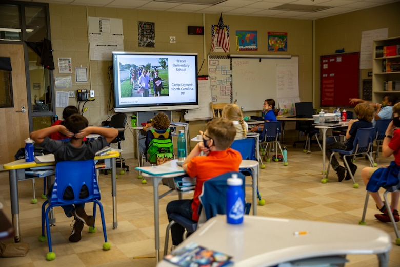 Students at Heroes Elementary School celebrate as their school is named a 2020 National Blue Ribbon School during a virtual ceremony on Marine Corps Base Camp Lejeune, North Carolina, Sept. 24, 2020. The United States Department of Education awards the National Blue Ribbon to schools that have shown a tremendous amount of academic excellence and improvement. (U.S. Marine Corps photo by Lance Cpl. Christian Ayers)