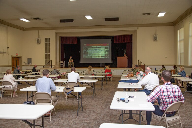 Officials and educators from Marine Corps Base Camp Lejeune and neighboring counties meet for a table top exercise at the Russell Marine and Family Services Center on MCB Camp Lejeune, North Carolina, Oct. 6, 2020. Camp Lejeune hosted the table top exercise to examine possible COVID-19 scenarios and impacts on the local Department of Defense Educational Activity (DoDEA) school system and surrounding community schools.  While this table top exercise highlighted lessons learned and specific implications for DoDEA schools, there will likely be value for schools in the surrounding communities to create similar COVID-19 scenarios across local educational activities. (U.S. Marine Corps Photo by Cpl. Ginnie Lee)