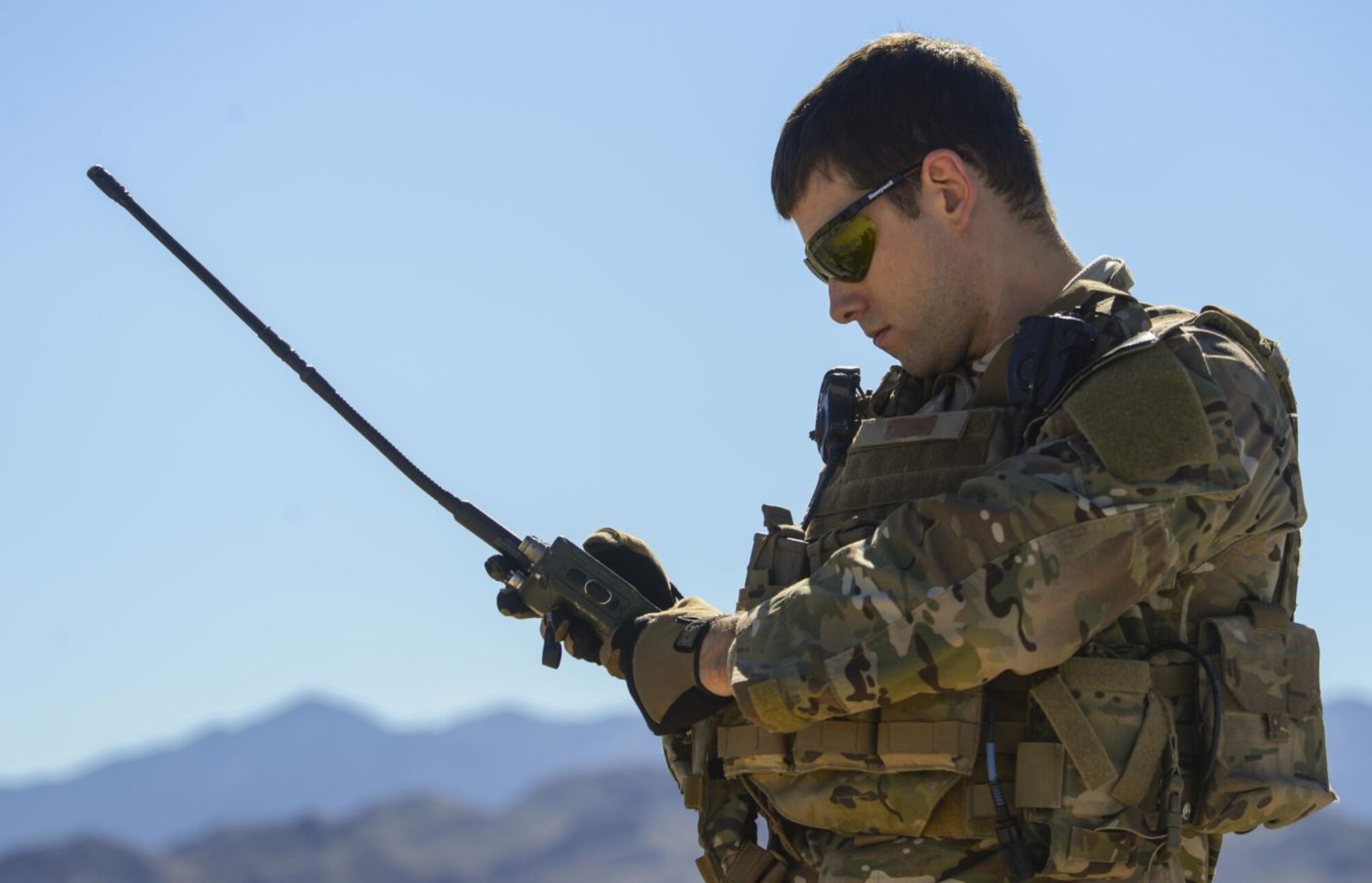 A joint terminal attack controller performs an operational assessment of a held radio at the Nevada Test and Training Range March 23, 2016. The Air-to-Ground, Tactical Data Links team at Hanscom Air Force Base, Mass. is currently working to upgrade radio technology across the services by providing an anti-jam, hack-proof, and high frequency radio system by 2024.