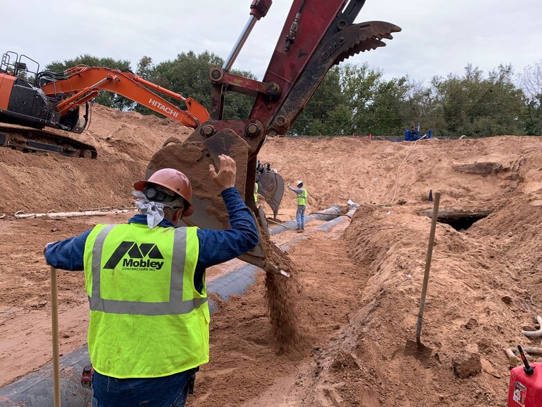 workers repairing a levee in Atkins, Arkansas