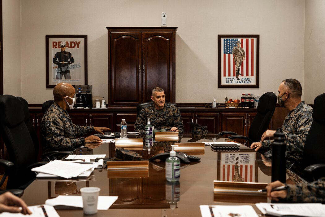 U.S. Marine Corps Maj. Gen. Jason Q. Bohm, the Commanding General of Marine Corps Recruiting Command (MCRC), (center), Sgt. Maj. Cortez L. Brown, the MCRC Sergeant Major, (left) and Col. James B. Conway, the Commanding Officer of 12th Marine Corps District (12MCD), (right), begin a brief at 12MCD Headquarters, Marine Corps Recruit Depot San Diego, on Oct. 14, 2020.  12MCD is one of six Marine Corps Districts under MCRC and is responsible for the procurement of qualified individuals, officer and enlisted, of the United States Marine Corps and the Marine Corps Reserve. (U.S. Marine Corps photo by Cpl. Tessa D. Watts)