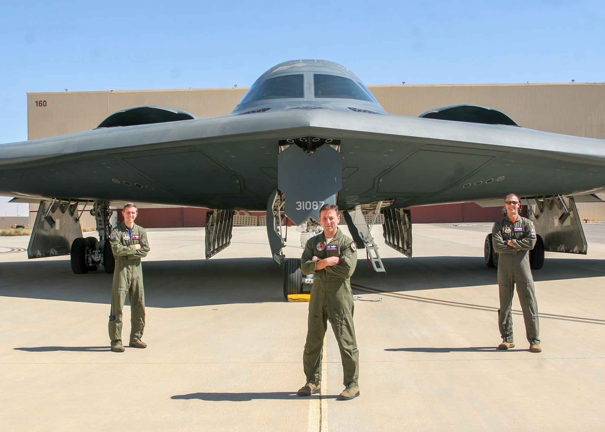 The 419th Flight Test Squadron's Maj. Matthew Gray, Jason DiGiacomo and Maj. Dustin Duke pose for a photo in front of the B-2 "Spirit of Pennsylvania" after it arrived to Edwards Air Force Base, California, Oct. 2. (Air Force photo by Kyle Brasier)