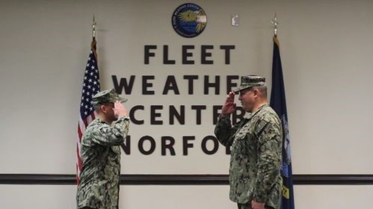 Cmdr. Matthew Cushanick, left, salutes Capt. Chris Gabriel, right, in the assumption of all duties and responsibilities as commanding officer of Strike Group Oceanography Team Norfolk during a virtual command establishment ceremony at Naval Station Norfolk, Virginia, on Oct. 1, 2020.