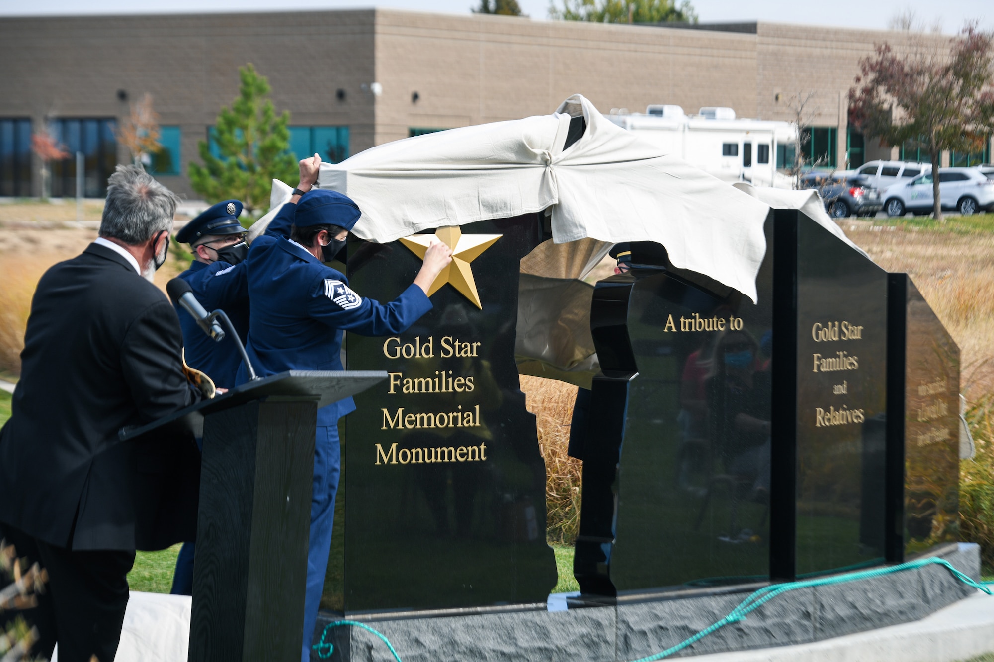 Senior enlisted leaders from Buckley Air Force Base unveil the Gold Star Families Memorial Monument Oct. 14, 2020, at the Colorado Freedom Memorial in Aurora, Colo.