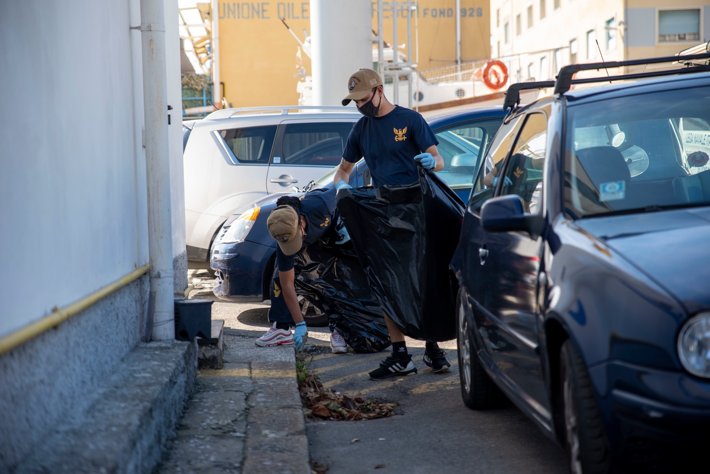 201007-N-EI510-0579 GENOA, Italy (Oct 7, 2020) Sailors, attached to the Blue Ridge-class command and control ship USS Mount Whitney (LCC 20), pick up trash while attending a community relations event during the ship's dry dock phase in San Giorgio Del Porto in Genoa, Italy, Oct. 7, 2020.  Mount Whitney, the U.S. 6th Fleet flagship, homeported in Gaeta, Italy entered its regularly scheduled overhaul to make improvements in order to increase the security and stability of the U.S. 6th Fleet aera of operations. (U.S. Navy photo by Mass Communication Specialist 2nd Class Scott Barnes)