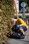 201007-N-EI510-0603 GENOA, Italy (Oct 7, 2020) Hospital Corpsman 3rd Class Donald Cooney, assigned to the Blue Ridge-class command and control ship USS Mount Whitney (LCC 20), picks up trash while attending a community relations event during the ship's dry dock phase in San Giorgio Del Porto in Genoa, Italy, Oct. 7, 2020.  Mount Whitney, the U.S. 6th Fleet flagship, homeported in Gaeta, Italy entered its regularly scheduled overhaul to make improvements in order to increase the security and stability of the U.S. 6th Fleet aera of operations. (U.S. Navy photo by Mass Communication Specialist 2nd Class Scott Barnes)