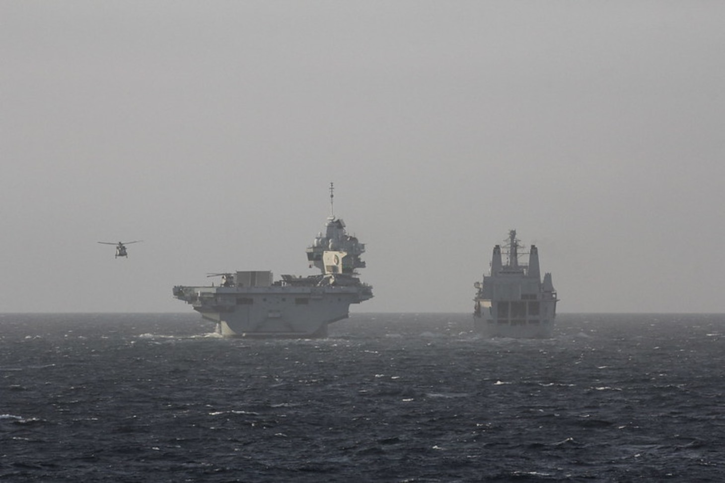 200930-N-N0901-004 NORTH SEA (Sept. 30, 2020) Royal Fleet Auxiliary RFA Fort Victoria (A387), right, joins the Royal Navy aircraft carrier HMS Queen Elizabeth (R08) and the Queen Elizabeth Carrier Strike Group in the North Sea during Exercise Joint Warrior 20-2, Sept. 30, 2020. Exercise Joint Warrior 20-2 is a U.K.-hosted, multilateral training exercise designed to provide NATO and allied forces with a unique multi-warfare environment to prepare for global operations. U.S. Naval Forces Europe-Africa/U.S. Sixth Fleet, headquartered in Naples, Italy, conducts the full spectrum of joint and naval operations, often in concert with allied and interagency partners, in order to advance U.S. national interests and security and stability in Europe and Africa. (U.S. Navy photo by Sonar Technician (Surface) 2nd Class Bethany Fults/Released)