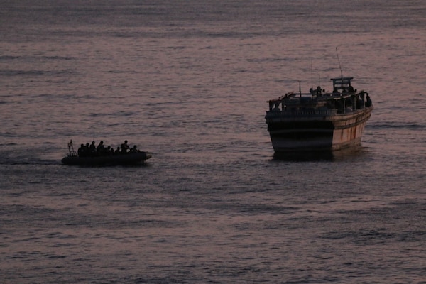 While under Combined Maritime Forces (CMF) tasking, a boarding team from USS Winston S. Churchill (DDG 81) provides food and water to an Iranian-flagged dhow in distress in the Arabian Sea, Oct. 15. The boarding team transited to the distressed vessel via a rigid-hull inflatable boat (RHIB) and conducted an initial seaworthiness inspection and to assist the mariners with provisions. Churchill remained on scene until Omani authorities could arrive and render further assistance to get the vessel underway. (U.S. Navy photo by Mass Communication Specialist 3rd Class Louis Staats IV)