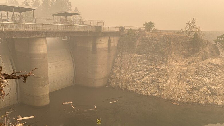 Smoke hangs heavy in the air around the Blue River Dam spillway Sept. 14; just days after the Holiday Farm Fire burned through the area; impacting Blue River and nearby Cougar Dam.