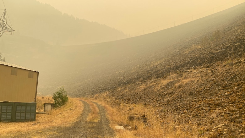 Smoke hangs heavy in the air around the main embankment at Cougar Dam Sept. 14, just days after the Holiday Farm Fire burned through the area, impacting Cougar and nearby Blue River Dam.