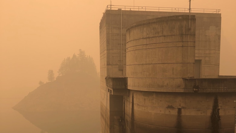 Smoke hangs heavy in the air around the Cougar Dam intake tower Sept. 11, just days after the Holiday Farm Fire burned through the area, impacting Cougar and nearby Blue River Dam.