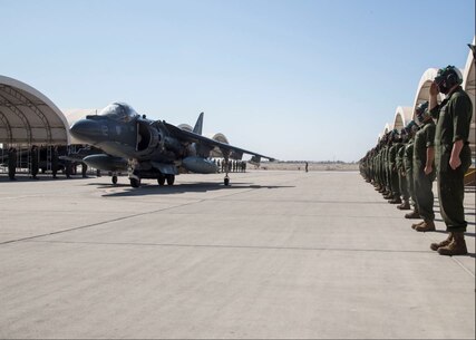 U.S. Marine Corps Lt. Col. Keith Bucklew, commanding officer of Marine Attack Squadron 311, taxis down the flightline in an AV-8B Harrier II assigned to VMA-311, Marine Aircraft Group 13, 3rd Marine Aircraft Wing, during his last flight at Marine Corps Air Station Yuma, Ariz., Oct. 14, 2020. The last flight is a significant event for every pilot and is celebrated by spraying the pilot and aircraft with water. (U.S. Marine Corps photo by Lance Cpl. Julian Elliott-Drouin)