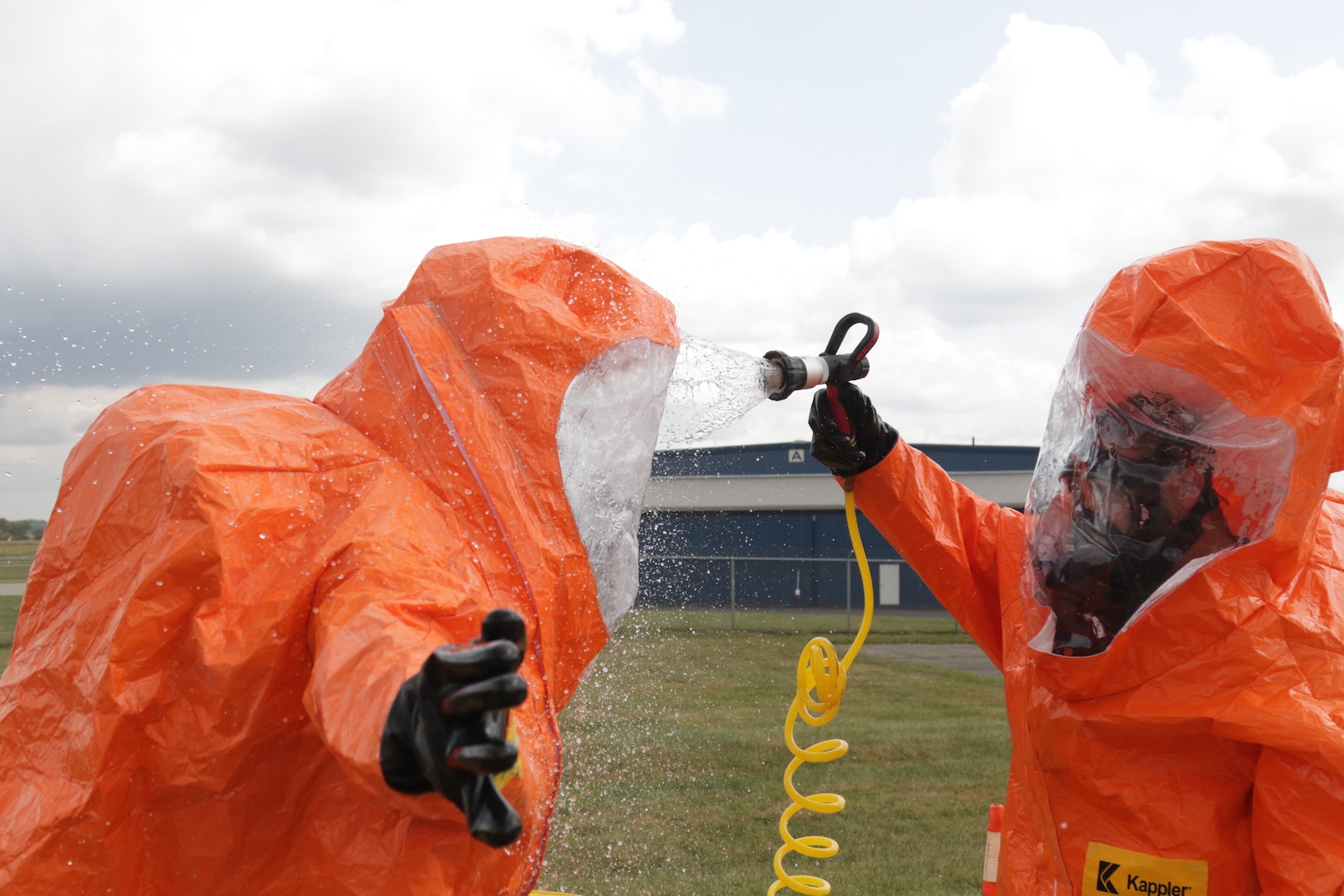 Members of the 52nd Civil Support Team (Weapons of Mass Destruction) decontaminate survey team personnel after exposure to an unknown agent during an exercise on Sept. 28, 2020, at the Fairfield County Airport, in Carroll, Ohio.