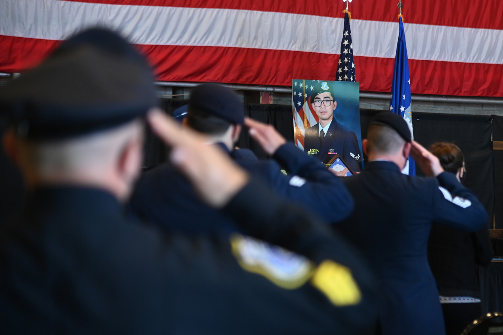 Members of the 66th Security Forces Squadron salute during Senior Airman Jason “Khai” Phan’s memorial service at Hanscom Air Force Base, Mass., Oct. 16. During the ceremony, wingmen remembered the fallen Airman, who died in a non-combat incident Sept. 12 while serving overseas. (U.S. Air Force photo by Linda LaBonte Britt)
