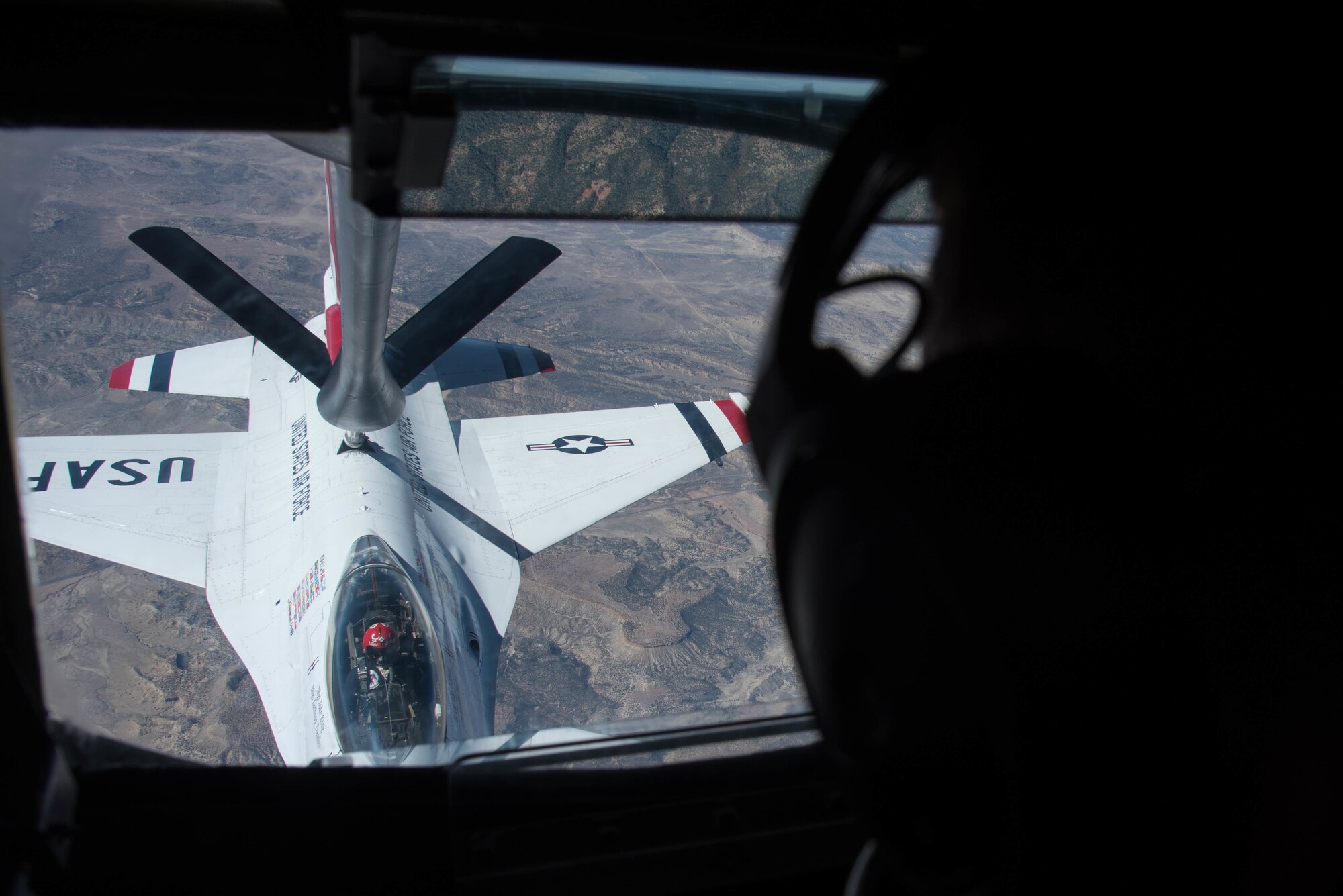 A KC-135 Stratotanker passes fuel to an F-16 Fighting Falcon Thunderbird Oct. 15, 2020, through the skies of New Mexico. The demonstration team was headed to Fort Worth, Texas, for the Bell Fort Worth Alliance Air Show from. The air show is scheduled for Oct. 17-18, 2020. (U.S. Air Force photo by Senior Airman Alexi Bosarge)