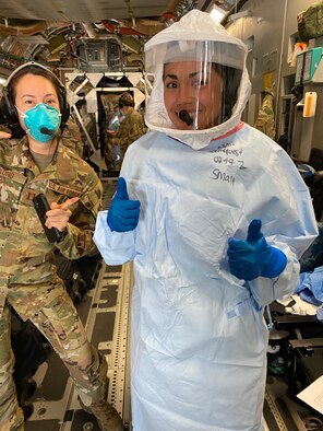 Capt. Alyssa Sandquist, flight nurse for the 36th Aeromedical Evacuation Squadron at Keesler Air Force Base, gives a thumbs up as she prepares to work alongside COVID-19 patients on a C-17 Globemaster. From April to September 2020, Sandquist was a part of the 10th Expeditionary Aeromedical Evacuation Flight at Ramstein Air Base, Germany where she helped transport COVID-19 positive individuals to proper care facilities. (Courtesy Photo)