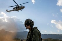 A U.S. Marine with Marine Light Attack Helicopter Squadron 367 awaits a UH-1Y Venom with HMLA-367, during a special patrol-insertion and extraction rigging and fast roping insertion extraction exercise, Scholfield Barracks, Oct. 8, 2020. SPIE and FRIE systems are used to rapidly insert and extract Marines and Soldiers when a landing zone is not available. (U.S. Marine Corps photo by Cpl. Jose Angeles)