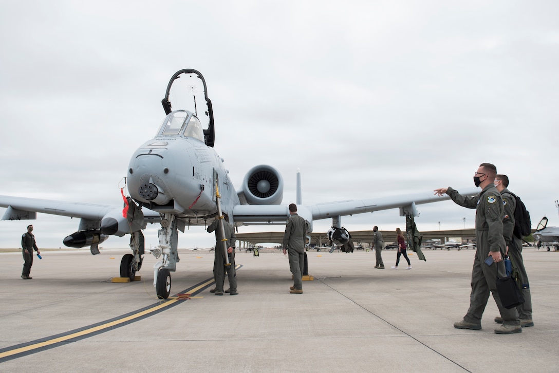47th Student Squadron students observe an A-10 Thunderbolt II from the A-10 Demonstration Team, Davis-Monthan Air Force Base, Ariz., as it visits Laughlin Air Force Base, Texas, on Oct. 13, 2020. Students and instructors gathered in small groups on the flight line to watch the A-10 perform a capabilities demonstration, and the A-10 pilots gave a capabilities briefing to students following the flight. (U.S. Air Force photo by Senior Anne McCready)