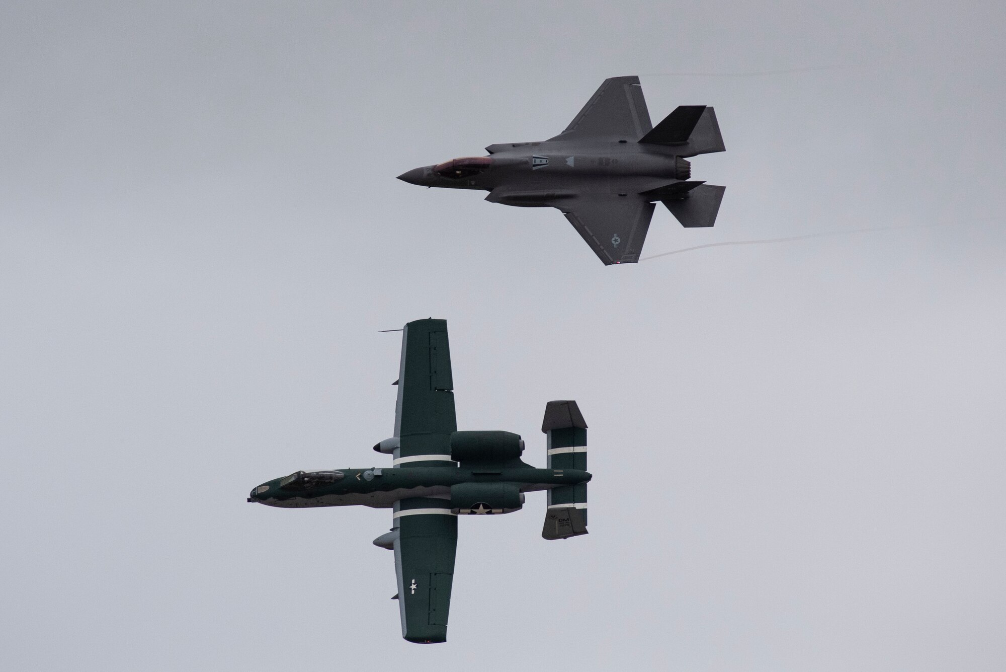 A-10 Thunderbolt II and F-35 Lightning II fly side by side together through the sky over Laughlin Air Force Base, Texas, Oct. 13, 2020. The pilots flew over the base to show the capabilities of the jets to the student pilots. (U.S. Air Force photo by Airman 1st Class David Phaff)