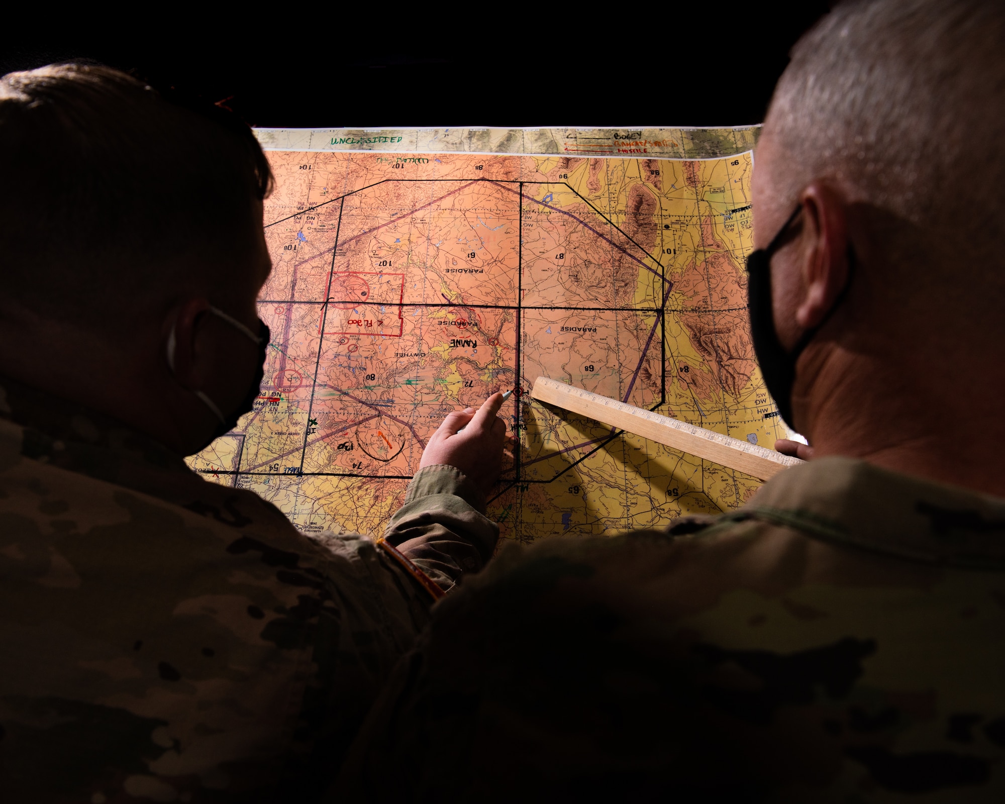 U.S. Air Force and U.S. Army service members mission plan at Mountain Home Air Force Base, Idaho, October 14, 2020. The 726th Air Control Squadron and the 31st Air Defense Artillery Defense Brigade have integrated their radar, communication networks and defense systems to increase readiness and joint operation efficiency for when they deploy together in the future. (U.S. Air Force photo by Senior Airman Andrew Kobialka)