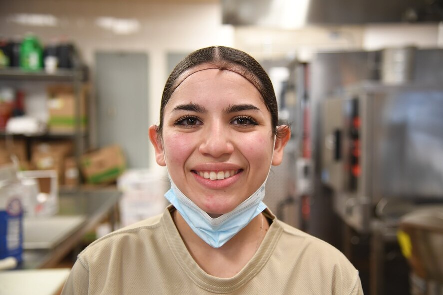 A1C Vanessa Alvarez, food assistant specialist from the 5th Force Support Squadron, is assisting the Prairie Vigilance exercise by working the Alert Diner on the flight line.