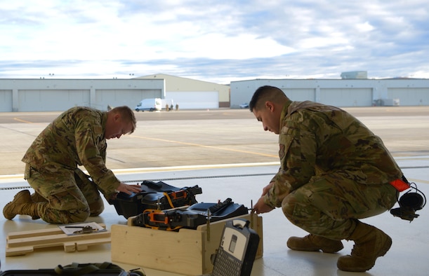 U.S. Air Force Tech. Sgt. Rylee James, right, a 354th Maintenance Squadron (MXS) Aircrew Egress F-35A Lightning II cadre member, and Staff Sgt. Victor Benitez, a 354th MXS Aircrew Egress journeyman, work on the new arctic survival seat kit for the F-35A on Eielson Air Force Base, Alaska, Sept. 28, 2020.