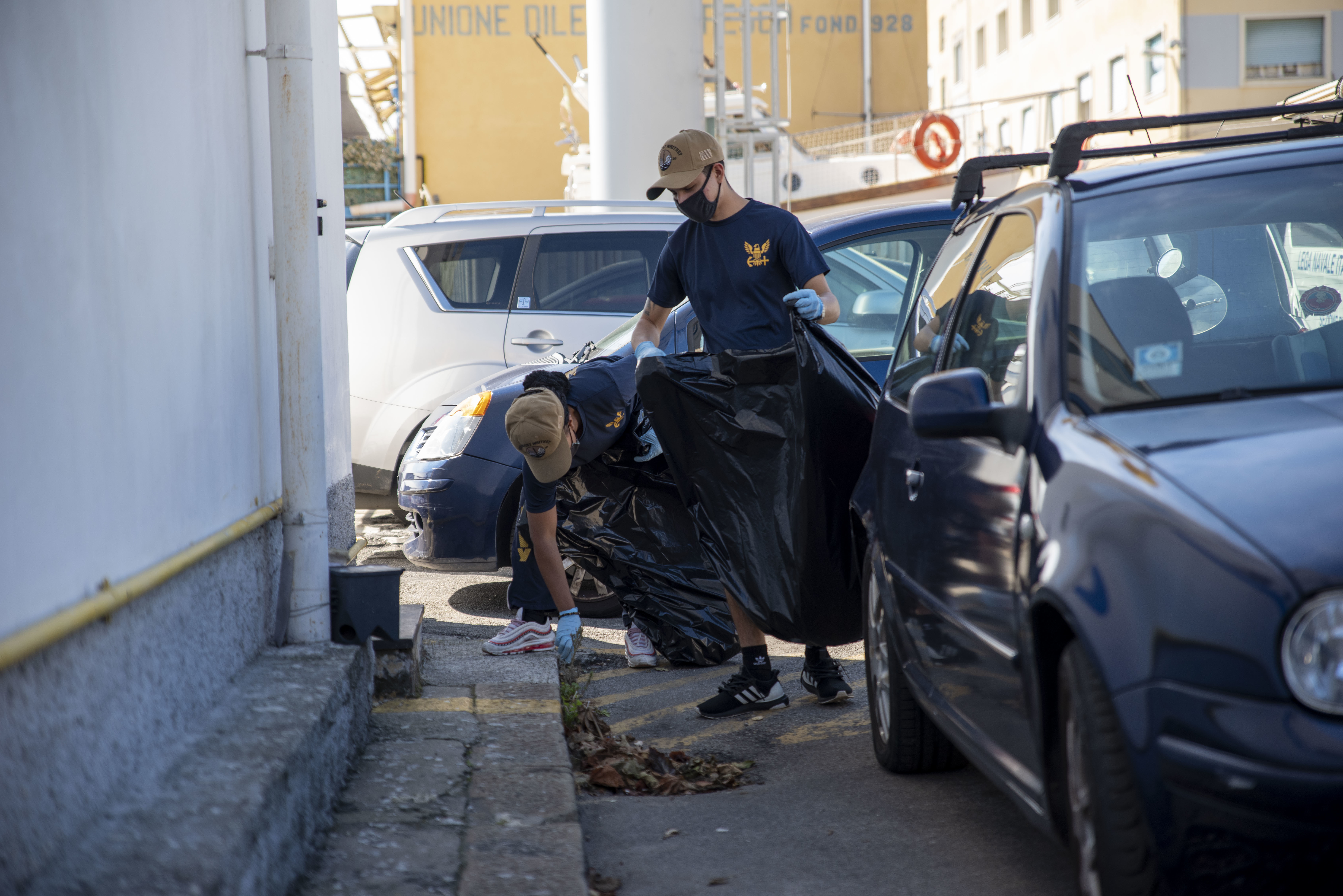 201007-N-EI510-0579 GENOA, Italy (Oct 7, 2020) Sailors, attached to the Blue Ridge-class command and control ship USS Mount Whitney (LCC 20), pick up trash while attending a community relations event during the ship's dry dock phase in San Giorgio Del Porto in Genoa, Italy, Oct. 7, 2020.  Mount Whitney, the U.S. 6th Fleet flagship, homeported in Gaeta, Italy entered its regularly scheduled overhaul to make improvements in order to increase the security and stability of the U.S. 6th Fleet aera of operations. (U.S. Navy photo by Mass Communication Specialist 2nd Class Scott Barnes)