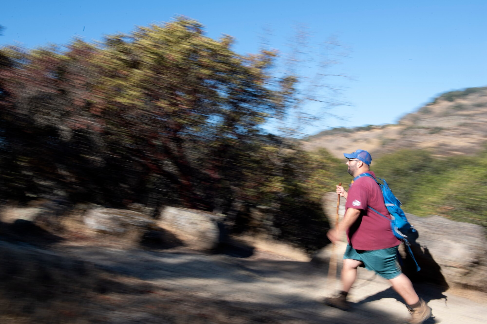 A man hiking on a trail.