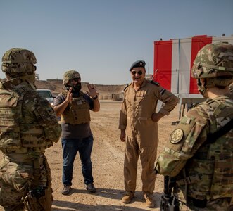 U.S. and Iraqi forces gather for the divestment of equipment from the U.S. government to the government of Iraq at a transfer point near Al Asad Air Base, Iraq, Oct. 15, 2020. Iraqi Maj. Gen. Saadoom Fouad, Q-West Air Base commander, received several containers consisting of air traffic control equipment that will build the Iraqi air force's capability to continue the fight to defeat the Islamic State of Iraq and Syria.(U.S. Army Reserve photo by Spc. Jorge Reyes)