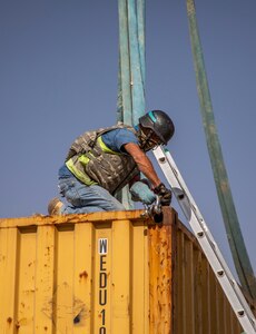 U.S. and Iraqi forces gather for the divestment of equipment from the U.S. government to the government of Iraq at a transfer point near Al Asad Air Base, Iraq, Oct. 15, 2020. Iraqi Maj. Gen. Saadoom Fouad, Q-West Air Base commander, received several containers consisting of air traffic control equipment that will build the Iraqi air force's capability to continue the fight to defeat the Islamic State of Iraq and Syria.(U.S. Army Reserve photo by Spc. Jorge Reyes)