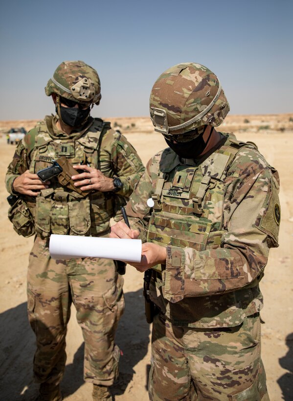 U.S. and Iraqi forces gather for the divestment of equipment from the U.S. government to the government of Iraq at a transfer point near Al Asad Air Base, Iraq, Oct. 15, 2020. Iraqi Maj. Gen. Saadoom Fouad, Q-West Air Base commander, received several containers consisting of air traffic control equipment that will build the Iraqi air force's capability to continue the fight to defeat the Islamic State of Iraq and Syria.(U.S. Army Reserve photo by Spc. Jorge Reyes)