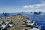 From left, USS Germantown (LSD 42), USNS John Ericsson (T-AO 194), USS Antietam (CG 54), USS Ronald Reagan (CVN 76), USS America (LHA 6), USS Shiloh (CG 67), USS New Orleans (LPD 18), and USS Comstock (LSD 45) break away from formation in support of Valiant Shield 2020. Valiant Shield is a U.S. only, biennial field training exercise (FTX) with a focus on integration of joint training in a blue-water environment among U.S. forces. This training enables real-world proficiency in sustaining joint forces through detecting, locating, tracking and engaging units at sea, in the air, on land and in cyberspace in response to a range of mission areas.