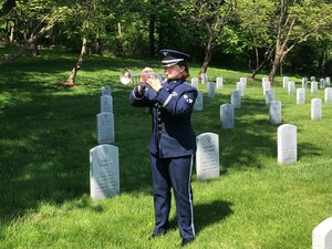 SrA Katherine Tonkin performing Taps on Memorial Day