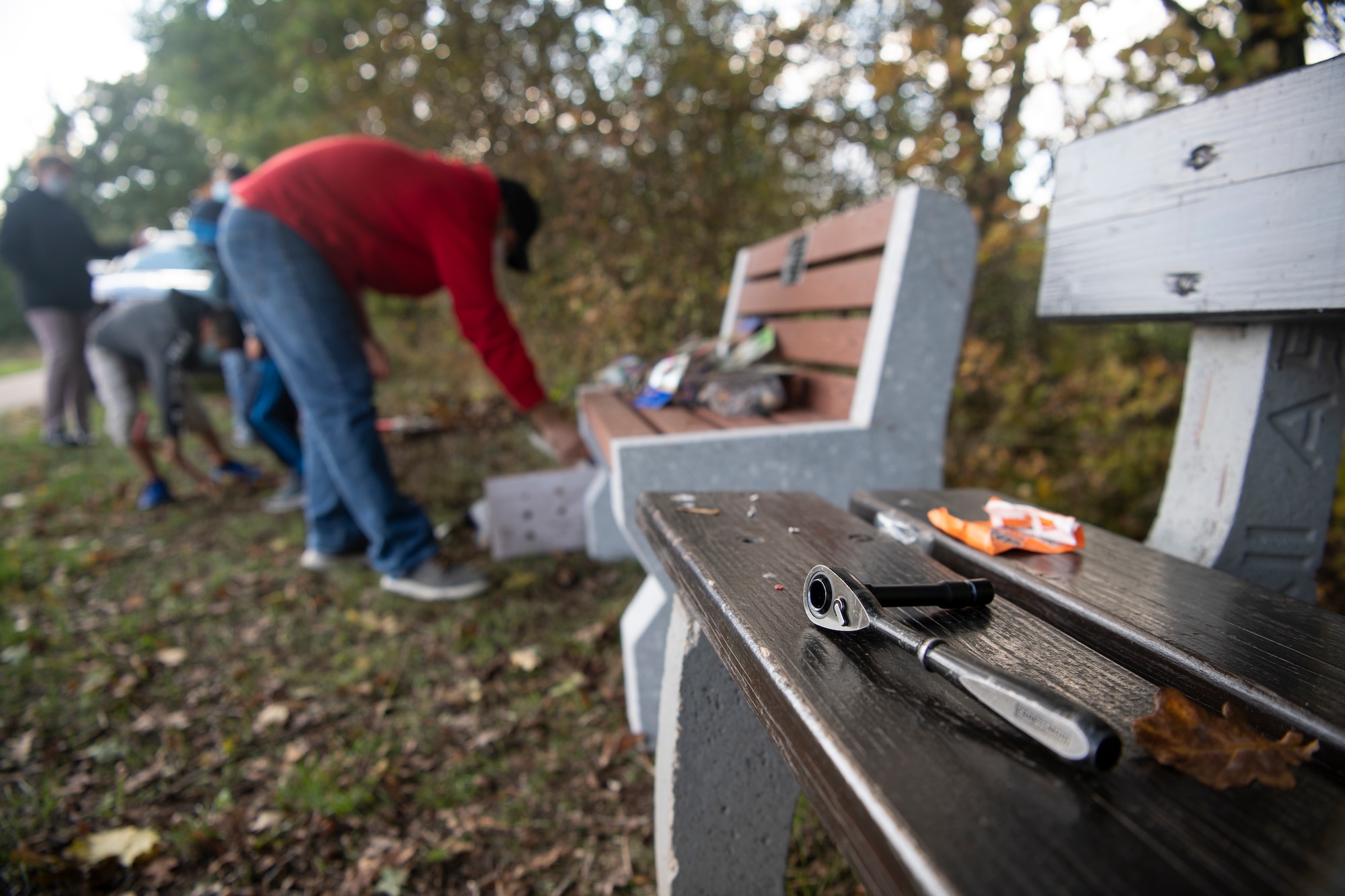 It was along the side of a small road in Binsfeld, among the newly fallen leaves and the cool, autumn air that Liliana, her husband, Javier, and several family members began constructing a bench Oct. 10