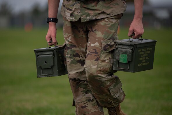 U.S. Air Force Tech. Sgt. Brandon Russell, 100th Security Forces Squadron lead instructor, assembles an M4 carbine rifle during the Battle of the Badges competition at Royal Air Force Mildenhall, England, Oct. 14, 2020. Held simultaneously with the fire muster, Battle of the Badges was organized to encourage camaraderie and teamwork between first-responders. (U.S. Air Force photo by Airman 1st Class Joseph Barron)