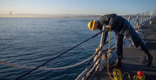 201018-N-KY668-1099 MEDITERRANEAN SEA (Oct. 18, 2020) Boatswain’s Mate 2nd Class Trevor Lovelace prepares mooring lines on the fo’c’sle aboard Arleigh Burke-class guided-missile destroyer USS Roosevelt (DDG 80) as the ship pulls into Algiers, Algeria for a scheduled brief stop for fuel, Oct. 18, 2020. Roosevelt, forward-deployed to Rota, Spain, is on its first patrol in the U.S. Sixth Fleet area of operations in support of regional allies and partners and U.S. national security interests in Europe and Africa. (U.S. Navy photo by Mass Communication Specialist Seaman Austin G. Collins/Released)