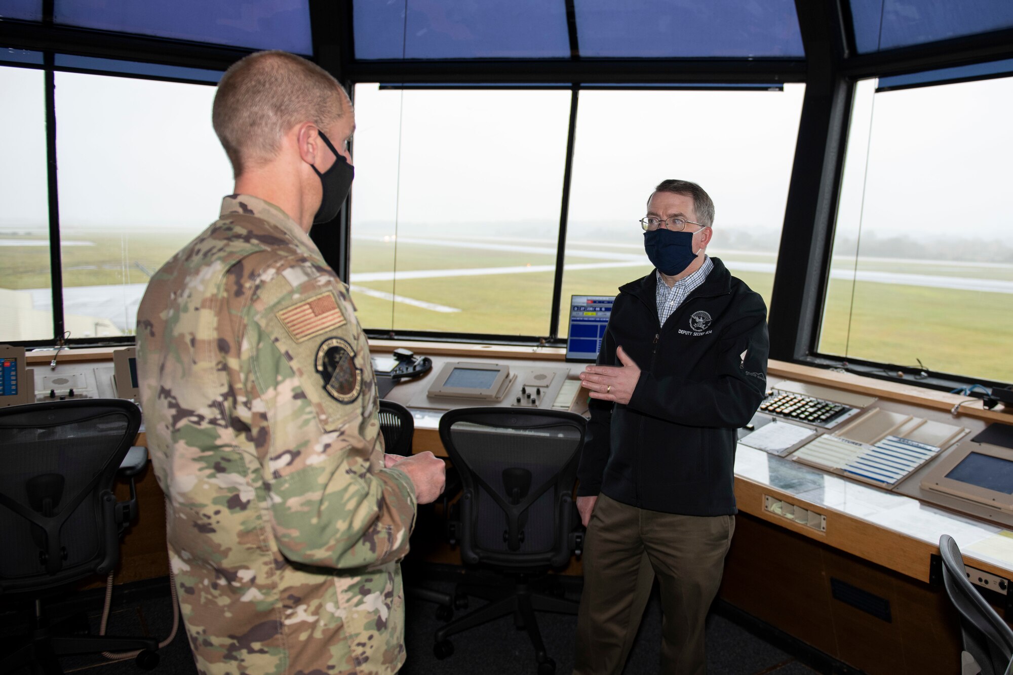 Deputy Secretary of Defense David L. Norquist, right, and U.S. Air Force Lt. Col. Joseph Knothe, left, 420th Air Base Squadron commander, discuss the runway and future construction plans at RAF Fairford, England, Oct. 12, 2020. The RAF Fairford aircraft runway is the longest military runway in the U.K. The visit highlighted the strategic importance of RAF Fairford, oriented him to the bomber and ISR missions in support of U.S. European Command and national defense strategy, and gave him the opportunity to engage with Airmen. (U.S. Air Force photo by Senior Airman Jennifer Zima)