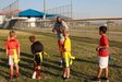 About 15 children maintained social distancing as they circled around their football coaches to receive instructions on their next drill. Conducted from Oct. 5-9, this was the first sports camp held on Joint Base San Antonio-Fort Sam Houston since the novel coronavirus pandemic began earlier this year.

“My overall love for sports is why I volunteer,” said Maj. John Twitty, U.S. Army South public affairs plans chief. “I want to teach kids the proper fundamentals and the importance of working together. It was special to be a part of coaching them and continue to have a strong tie with local community.”