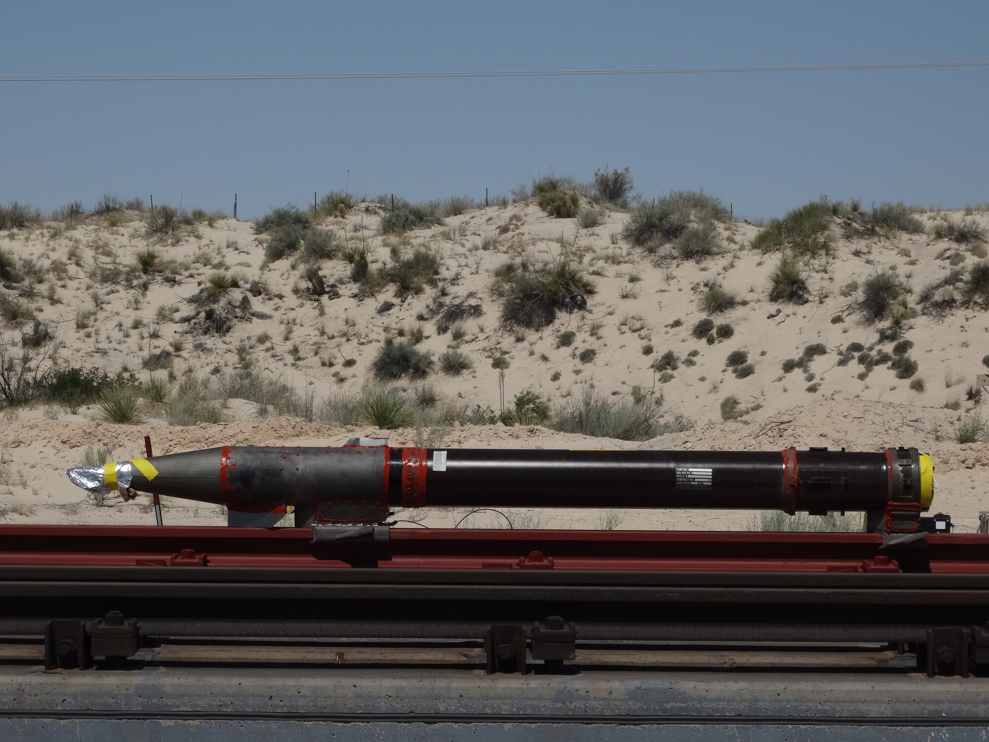 A rocket sled is shown just before launch on the Holloman High Speed Test Track at Holloman Air Force Base, New Mexico. The 9-inch monorail sled was launched as part of the Hypersonic Readiness program, which is a series of tests being conducted by the 846th Test Squadron at Holloman to prepare for future rocket sled testing to support programs and projects including the Hypersonic Test and Evaluation Investment Portfolio and Air-Launched Rapid Response Weapon, as well as hypersonic sled tests for other customers. (U.S. Air Force photo)