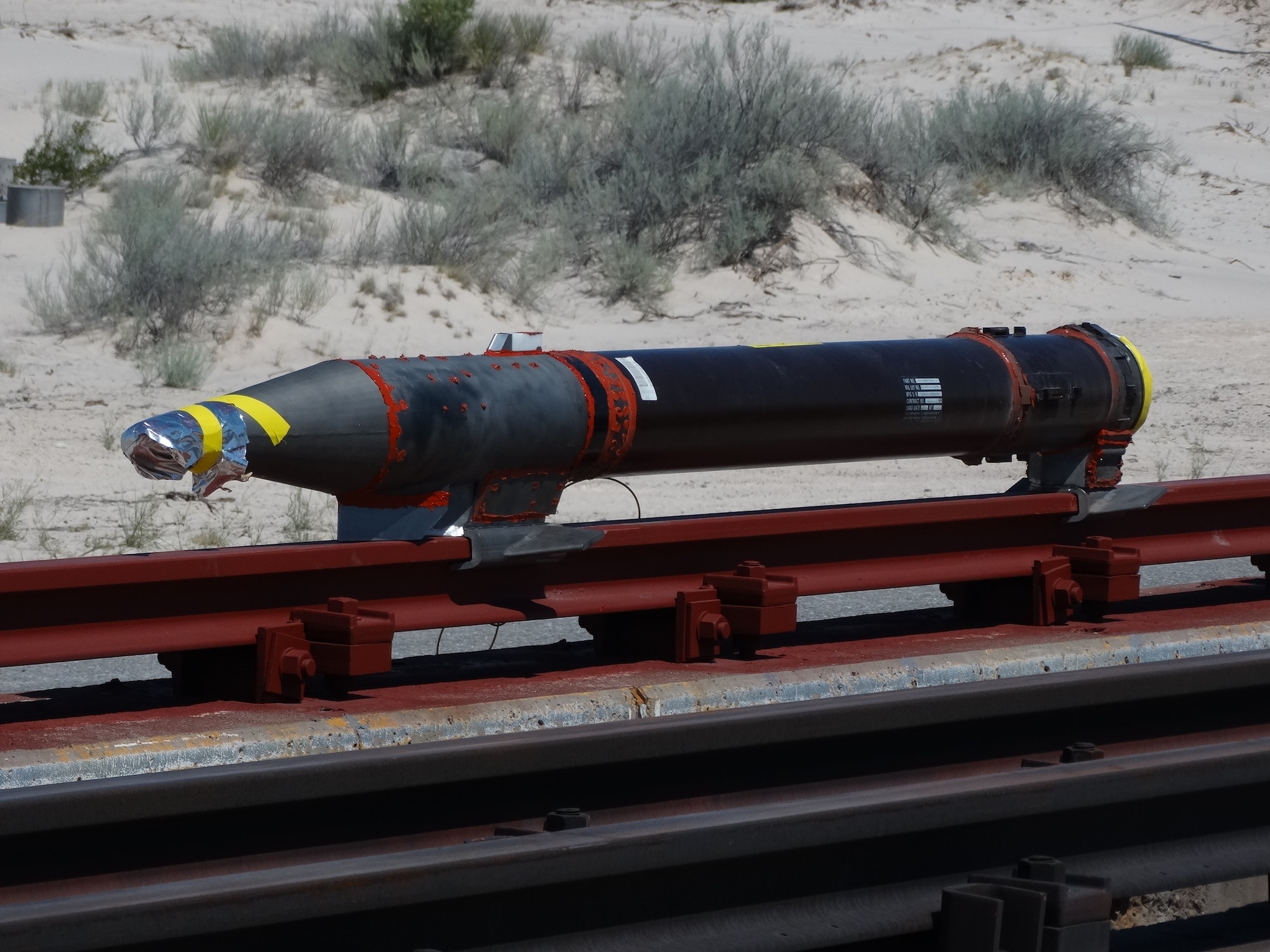 A rocket sled is shown just before launch on the Holloman High Speed Test Track at Holloman Air Force Base, New Mexico. The 9-inch monorail sled was launched as part of the Hypersonic Readiness program, which is a series of tests being conducted by the 846th Test Squadron at Holloman to prepare for future rocket sled testing to support programs and projects including the Hypersonic Test and Evaluation Investment Portfolio and Air-Launched Rapid Response Weapon, as well as hypersonic sled tests for other customers. (U.S. Air Force photo)