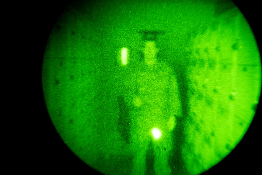 Senior Airman Sam Phillippi, 911th Operations Support Squadron aircrew flight equipment technician, twirls infrared chemical light sticks to demonstrate the use of night vision goggles as part of a 911th Operations Group open house event at the Pittsburgh International Airport Air Reserve Station, Pennsylvania, Oct. 2, 2020.